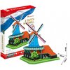 Pudełko z puzzlami 3D przedstawia holenderski wiatrak z 71 elementów, z widocznym logo "CubicFun" oraz napisem "Dutch Windmill". Obok pudełka znajduje się złożony model wiatraka z niebieskimi skrzydłami, zieloną podstawą i pomarańczowym dachem, a także po