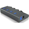 Czarny hub USB z czterema niebieskimi portami USB 3.0 na górze oraz jednym portem USB 3.0 i gniazdem zasilania DC 5V z boku. Na obudowie widoczne są również cztery przyciski oraz niebieskie diody sygnalizacyjne.