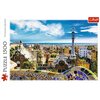 Puzzle przedstawiają widok na Park Güell w Barcelonie z charakterystycznymi budowlami i mozaikami, a w tle widać panoramę miasta i morze. Na opakowaniu znajduje się napis "Puzzle 1500" oraz logo "Trefl".