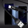 Czarny kabel USB - USB-C marki USAMS U5 o długości 1,2 m jest przedstawiony na tle trzech smartfonów. Na wtyczce USB widoczny jest napis "USAMS".