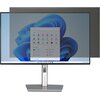 Na zdjęciu widoczny jest monitor z nałożonym filtrem prywatyzującym, który przyciemnia górną część ekranu. Na ekranie wyświetlany jest interfejs systemu operacyjnego z ikonami aplikacji i menu startowym.