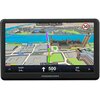 Nawigacja samochodowa wyświetla mapę 3D z trasą prowadzącą przez Londyn, z widocznymi nazwami ulic, takimi jak Westminster Bridge Road i Bridge Street, oraz ikoną ograniczenia prędkości do 30. Na dole ekranu znajdują się informacje o czasie, odległości i kierunku, a na obudowie widnieje logo "MODECOM".