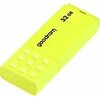 Żółty pendrive z napisem "goodram" oraz oznaczeniem pojemności "32 GB" na obudowie. Na powierzchni widoczne są wypukłe kwadraty.
