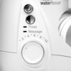 Zbliżenie na panel sterowania irygatora stacjonarnego z widocznym logo "Waterpik waterflosser". Na panelu znajdują się przyciski oraz pokrętło z oznaczeniami "Floss", "Massage" i numeracją od 2 do 10.