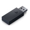 Czarny adapter USB z widocznym logo PlayStation na obudowie. Adapter ma prostokątny kształt z metalowym złączem USB.