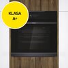 Czarny piekarnik elektryczny marki Haier jest wbudowany w drewnianą zabudowę kuchenną. Na żółtym okręgu widnieje napis "KLASA A+".