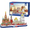 Na zdjęciu znajduje się zestaw puzzli 3D przedstawiający panoramę Moskwy, z charakterystycznymi budowlami, takimi jak cerkwie z kolorowymi kopułami. Na opakowaniu widnieje napis "CubicFun CityLine Moscow 3D Puzzle" oraz informacja o liczbie elementów: "20