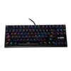 Czarna klawiatura mechaniczna z podświetleniem RGB, posiadająca pełny układ klawiszy, w tym klawisze funkcyjne od F1 do F12 oraz logo "Aurora" w prawym dolnym rogu. Każdy klawisz jest podświetlony w różnych kolorach, tworząc efekt tęczy.