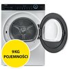 Na zdjęciu widoczna jest suszarka z otwartymi drzwiami, z panelem sterowania na górze, na którym znajduje się logo "Haier" oraz wyświetlacz z przyciskami. Na żółtym okręgu umieszczono napis "9KG POJEMNOŚCI".