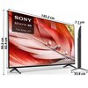 Telewizor z cienką ramką, wyświetlający obraz z czerwonymi piórami i kroplami wody, z widocznymi wymiarami: 145,2 cm szerokości, 90,5 cm wysokości, 7,1 cm głębokości oraz 33,8 cm podstawy. Na ekranie widoczny jest tekst: "SONY BRAVIA XR Full Array LED", "