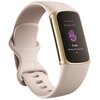 Biało-złoty smartband z wyświetlaczem pokazującym tekst: "Pomiar EDA", ikonę dłoni z linią pulsu oraz napis "3 min" i "Dotknij, aby rozpocząć". Pasek urządzenia ma kilka otworów do regulacji.