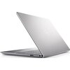 Srebrny laptop z widocznym logo "Dell" na pokrywie, częściowo otwarty, ukazujący klawiaturę i porty boczne. Urządzenie ma smukły, nowoczesny design.