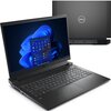 Na zdjęciu widoczny jest otwarty laptop z wyświetlonym na ekranie interfejsem systemu Windows 11, a w tle znajduje się zamknięta pokrywa z logo "Dell". Laptop ma czarną klawiaturę i touchpad, a na ekranie widać ikonki aplikacji.