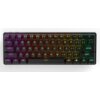 Klawiatura mechaniczna z podświetleniem RGB, na której widoczne są klawisze z oznaczeniami liter, cyfr i symboli, w tym ESC, TAB, CAPS, SHIFT, CTRL, ALT, ENTER. Klawisze są podświetlone w różnych kolorach, tworząc gradient od fioletowego przez pomarańczowy do zielonego.