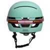 Miętowy kask z wbudowaną lampką, posiada napis "REDEFINE YOUR SAFETY" oraz pokrętło z napisem "ROTATE". Kask ma otwory wentylacyjne i regulowane paski.