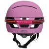 Różowy kask z wbudowaną lampką LED, z napisem "REDEFINE YOUR SAFETY" na tylnej części. Posiada regulację rozmiaru z oznaczeniem "SIZE M ROTATE TO TIGHTEN".