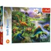 Opakowanie puzzli przedstawia kolorową ilustrację z różnymi dinozaurami w bujnym, tropikalnym krajobrazie z rzeką i górami w tle. Na opakowaniu widnieje napis "Trefl Puzzle", liczba elementów "200" oraz oznaczenie wiekowe "7+", a w rogu znajduje się logo 