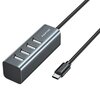 Na zdjęciu znajduje się hub USB w kolorze metalicznym z czterema portami USB i kablem zakończonym wtykiem USB typu C. Na obudowie huba widoczne jest logo "AWEI".