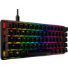 Na zdjęciu znajduje się klawiatura mechaniczna z podświetleniem RGB, z widocznymi klawiszami oznaczonymi literami i symbolami, takimi jak "ESC", "QWERTY", "CTRL", "ALT". Klawiatura ma kompaktowy układ i jest podłączona kablem.