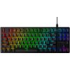Na zdjęciu znajduje się klawiatura mechaniczna z podświetleniem RGB, z widocznymi klawiszami funkcyjnymi od F1 do F12 oraz logo "HYPERX" w prawym dolnym rogu. Klawisze są podświetlone w różnych kolorach, tworząc efekt tęczy.