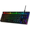 Na zdjęciu znajduje się klawiatura mechaniczna z podświetleniem RGB, z widocznym logo "HYPERX" w prawym dolnym rogu. Klawisze są podświetlone w różnych kolorach, tworząc efekt tęczy.