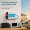 Na zdjęciu widoczna jest przetwornica z napisem "EXTRALINK Pure Sine Wave Inverter 2000W Surge Power 4000W" podłączona do akumulatora i oscyloskopu, na którym wyświetlany jest wykres sinusoidalny. W tle znajduje się kamper z panelami słonecznymi na dachu,