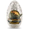 Owalny obiekt przypominający jajko z pękającą powierzchnią, na którym znajduje się ilustracja stegozaura oraz tekst "DINO PUZZLE EGG STEGOSAURUS".