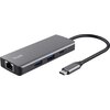 Na zdjęciu znajduje się szary hub USB z logo "Trust" na górnej powierzchni, wyposażony w porty Ethernet, dwa porty USB oraz port USB Typu C, z podłączonym kablem zakończonym wtykiem USB Typu C.