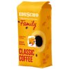 Żółte opakowanie kawy ziarnistej z napisem "EDUSCHO - Coffee heritage since 1924" oraz "Family" w kolorze czerwonym. Na opakowaniu widnieją również napisy: "Invigorating & Strong", "INTENSITY", "CLASSIC COFFEE", a także grafiki ziaren kawy i filiżanki.