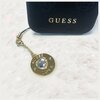 Zawieszka do telefonu GUESS Phone Strap Heart Diamond Charm with Rhinestones Złoty Kolor Złoty