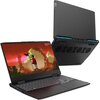 Na zdjęciu widoczny jest laptop z otwartym ekranem, na którym wyświetlana jest grafika przedstawiająca postać w czerwonym płaszczu na tle pomarańczowego nieba i okrągłej struktury. Obok znajduje się widok z tyłu zamkniętego laptopa, ukazujący system wenty