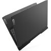 Na zdjęciu widoczny jest czarny laptop z częściowo otwartą pokrywą, na której znajdują się dwa logo "Lenovo". Klawiatura jest częściowo widoczna, a obudowa ma matowe wykończenie.