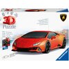 Na zdjęciu znajduje się opakowanie puzzli 3D przedstawiające czerwony samochód sportowy z logo Lamborghini, z napisem "3D Puzzle" oraz informacjami o produkcie, takimi jak "Stabil – ohne Klebstoff", "Sturdy – no glue required", "Mit beweglichen Rädern", "