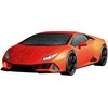 Na zdjęciu znajduje się pomarańczowy model samochodu sportowego złożony z puzzli 3D, przedstawiający Lamborghini Huracan Evo. Na powierzchni modelu widoczne są linie podziału puzzli, a na przodzie znajduje się logo producenta samochodu.