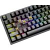 Na zdjęciu znajduje się klawiatura mechaniczna z podświetleniem RGB, z kilkoma zdjętymi klawiszami, ukazującymi żółte przełączniki. Widoczne są klawisze z oznaczeniami takimi jak "ESC", "Tab", "CapsLk", "Shift", "Ctrl", "Win", "Alt" oraz cyfry i litery z 