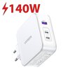 Biała ładowarka sieciowa z logo "UGREEN" posiada trzy porty: USB-A, USB-C2 z oznaczeniem "PD 100W" oraz USB-C1 z oznaczeniem "PD 140W". Nad ładowarką widnieje czerwony napis "140W" z symbolem błyskawicy.