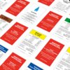 Na zdjęciu widoczne są karty z gry planszowej "Monopoly Mega" z różnymi nazwami ulic i wartościami hipotecznymi, w tym "Toruń ul. Mostowa", "Wrocław ul. Jatki" oraz "Gazownia". Karty mają różne kolory tła, takie jak czerwony, żółty i biały, a teksty na ni