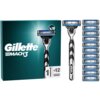 Opakowanie golarki z napisem "Gillette Mach3" oraz grafiką przedstawiającą golarkę i 12 wymiennych ostrzy. Na opakowaniu widnieje symbol golarki z liczbą "1" oraz symbol ostrzy z liczbą "+12".