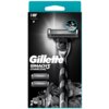 Opakowanie golarki z napisem "Gillette Mach3 Charcoal" oraz grafiką przedstawiającą golarkę na tle węgla drzewnego. Widoczne są także dwa dodatkowe ostrza oraz ikony wskazujące na liczbę ostrzy i kroplę wody.