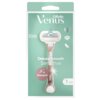 Na zdjęciu znajduje się opakowanie golarki w kolorze różowo-złotym z napisem "Gillette Venus Deluxe Smooth Sensitive". Widoczne są również oznaczenia "Skin Cushion", "5", "Rosegold" oraz ikony diamentu i piórka.