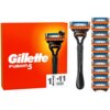 Pomarańczowe opakowanie z białym napisem "Gillette Fusion5" oraz grafiką golarki i jedenastu ostrzy. Obok opakowania znajduje się czarna golarka z pomarańczowymi elementami oraz jedenaście wymiennych ostrzy ułożonych pionowo.