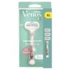 Opakowanie produktu "Gillette Venus Deluxe Smooth Sensitive" w kolorze rosegold, zawierające golarkę oraz trzy wymienne ostrza, z widocznym logo "Venus" i oznaczeniem "XL". Na opakowaniu znajduje się również napis "Skin Cushion" oraz symbol kropli wody na