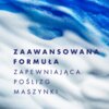 Na zdjęciu widoczna jest tekstura przypominająca pianę w odcieniach bieli i niebieskiego. Na tle znajduje się tekst: "ZAAWANSOWANA FORMUŁA ZAPEWNIAJĄCA POŚLIZG MASZYNKI".