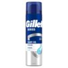 Puszka żelu do golenia marki Gillette Series, z niebieską nakrętką i etykietą w odcieniach niebieskiego i srebrnego, zawiera napisy: "SHAVE GEL", "REVITALIZING", "WITH GREEN TEA", "SENSITIVE" oraz "SCENTED". Na etykiecie widoczna jest także grafika kropli