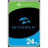 Na zdjęciu widoczny jest dysk twardy z logo "SEAGATE" na zielonym tle, poniżej znajduje się niebieski symbol ptaka oraz napis "SKYHAWK AI" na czarnym tle. W dolnej części widnieje biały napis "24TB" na niebieskim tle.