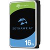 Na zdjęciu widoczny jest dysk twardy z etykietą w kolorach zielonym, czarnym i niebieskim, z logo "SEAGATE" na górze oraz napisem "SKYHAWK AI" i oznaczeniem pojemności "16 TB" na dole.