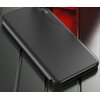 Czarne, matowe etui TECH-PROTECT Flip View Pro do Samsung Galaxy A05s leży na powierzchni o metalicznym wykończeniu. Na etui widoczny jest wyświetlacz z godziną "12:45".
