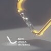 Fragment etui z przezroczystego materiału z żółtym akcentem, widoczny na szarym tle. W lewym dolnym rogu znajduje się biały napis: "ANTI SHOCK MATERIAL".