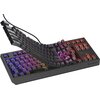 Na zdjęciu znajduje się czarna klawiatura mechaniczna z podświetleniem RGB, z widocznymi przełącznikami i klawiszami unoszącymi się nad podstawą. W prawym dolnym rogu znajduje się logo "GENESIS".