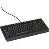 Na zdjęciu widoczna jest czarna klawiatura mechaniczna z podświetleniem RGB, posiadająca układ TKL (tenkeyless), co oznacza brak bloku numerycznego. Na obudowie klawiatury znajduje się logo "GENESIS".